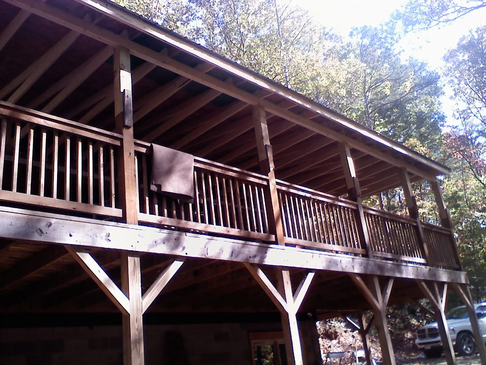 Timber framing under a new elevated porch and deck — Roof Leak Repair in Morrisonville by Roofing Brothers